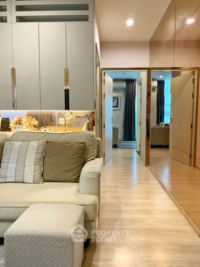 Modern living room with stylish decor and cozy seating in a contemporary apartment.