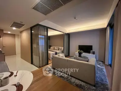 Modern open-plan living room with cozy seating and stylish decor