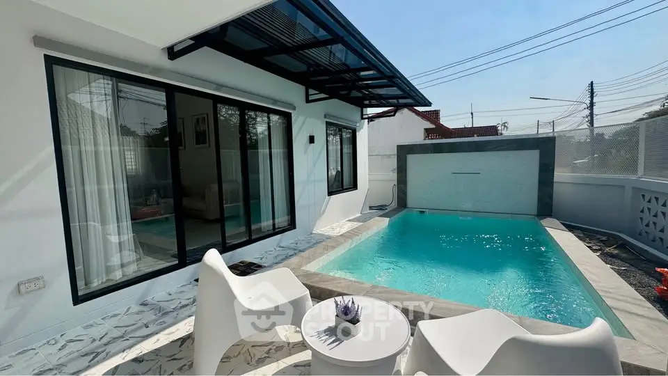 Modern villa with private pool and stylish outdoor seating area