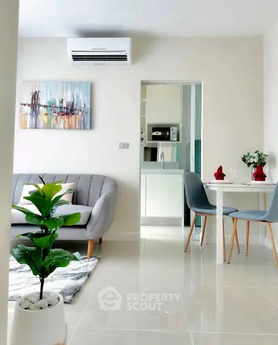 Modern living room with stylish decor and open kitchen layout