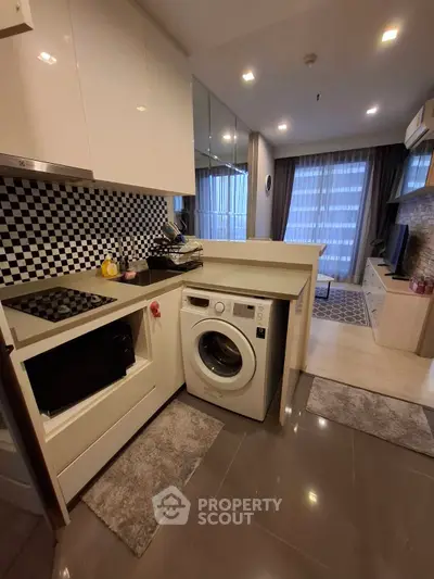 Modern kitchen with integrated washing machine and sleek design