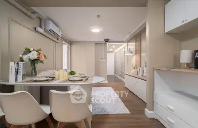 Modern dining and living area with elegant decor and neutral tones