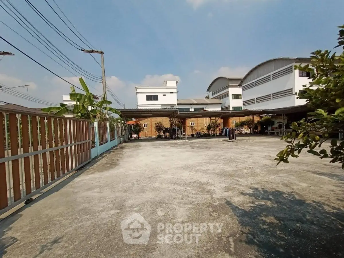 Spacious residential building with large open courtyard and clear blue sky