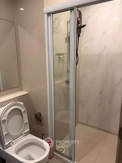 Modern bathroom with shower and toilet in sleek design