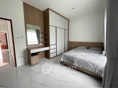 Spacious modern bedroom with sleek design and ample storage