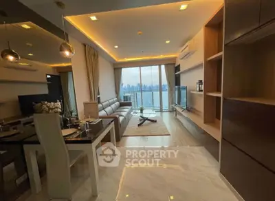 Luxurious living room with stunning city view, modern furnishings, and elegant lighting in a high-rise apartment.