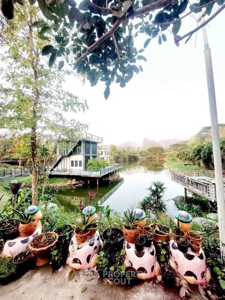 Charming lakeside property with lush greenery and serene water views, perfect for nature lovers seeking tranquility.