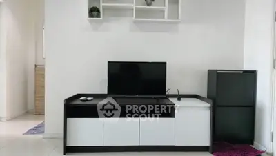 Modern living room with sleek TV stand and minimalist decor