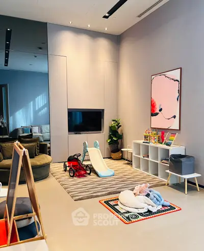 Chic modern living room with play area, stylish decor, and cozy seating.