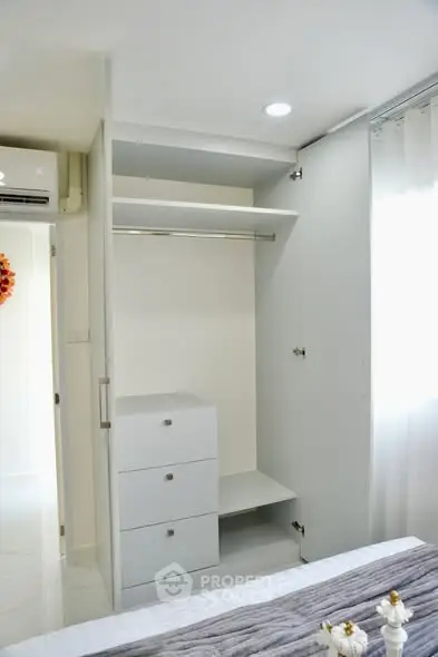 Modern bedroom with built-in wardrobe and sleek design