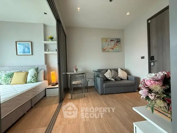 Modern studio apartment with cozy living area and stylish decor