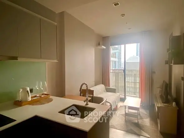 Modern living room with open kitchen and city view balcony