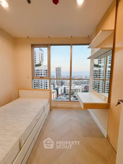 Cozy bedroom with stunning city view and natural light