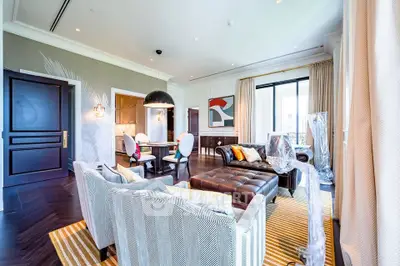 Luxurious living room with elegant decor and open layout, featuring stylish furniture and modern lighting.