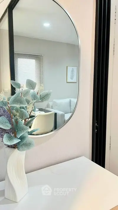 Modern interior with stylish mirror and elegant decor in a cozy living space.