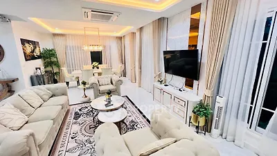 Luxurious living room with elegant decor, plush seating, and ambient lighting for a sophisticated lifestyle.