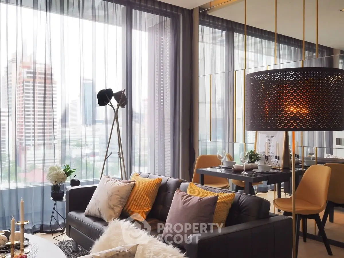 Luxurious modern living room with city view, stylish decor, and elegant furnishings in a high-rise apartment.