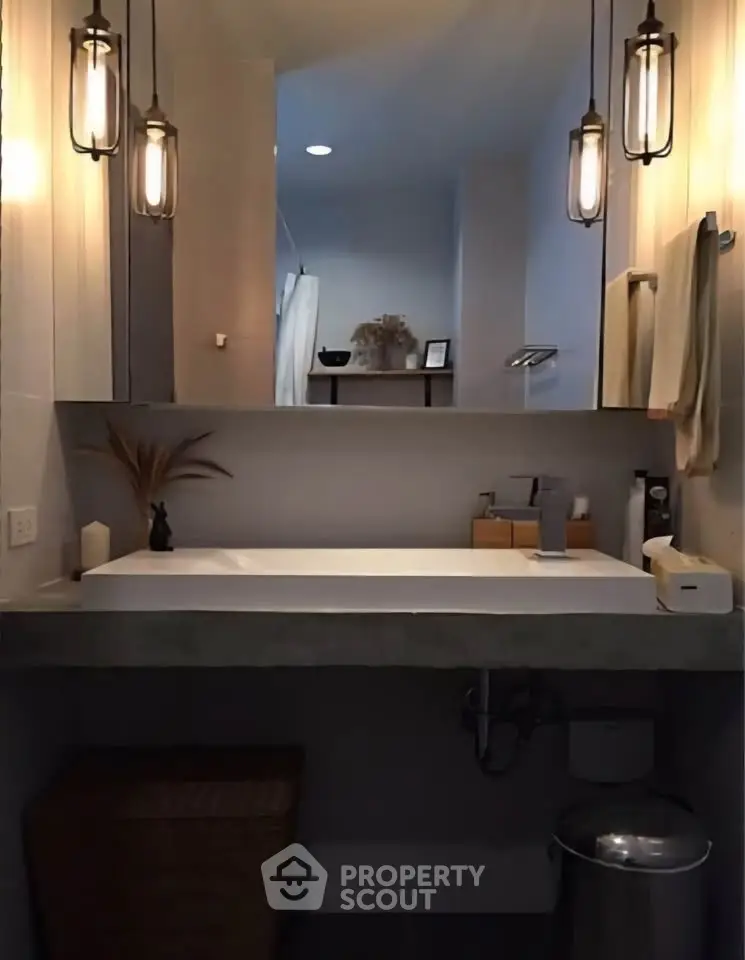 Modern bathroom with stylish lighting and sleek vanity design