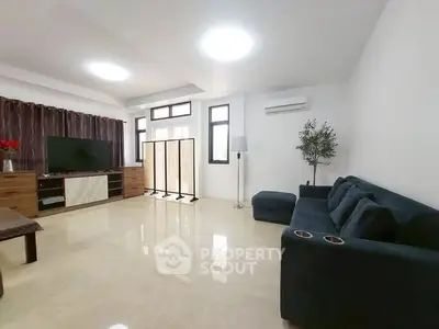 Spacious modern living room with sleek furniture and natural light