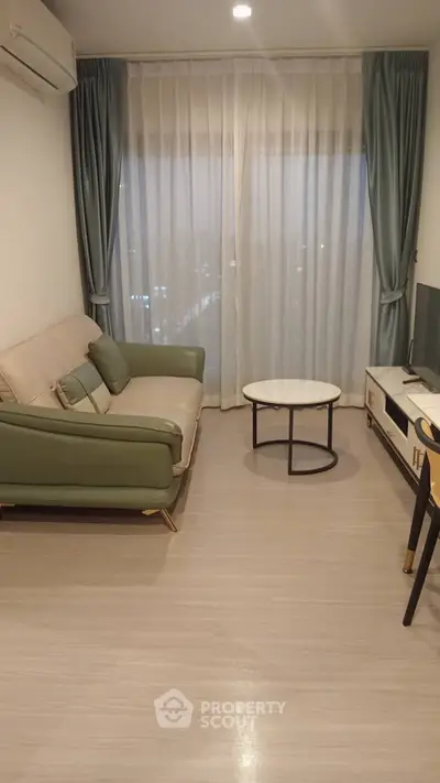 Modern living room with stylish furniture and large window view