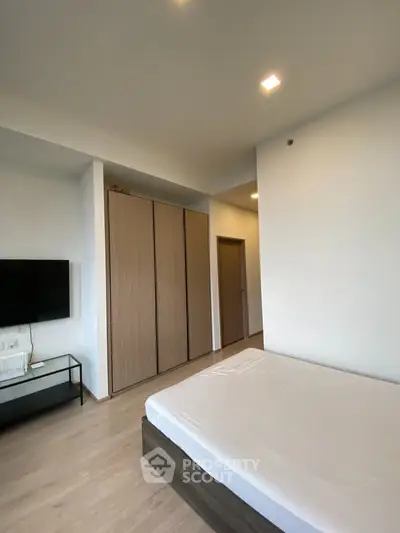 Modern bedroom with minimalist design and built-in wardrobe