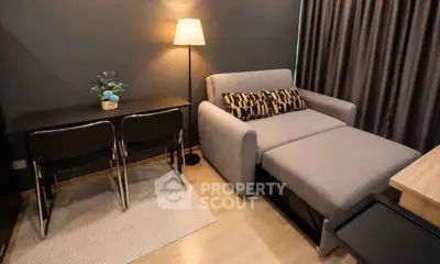 Cozy living room with modern sofa and dining area in stylish apartment