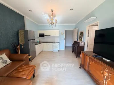 Charming living room with elegant decor and modern kitchen in open layout