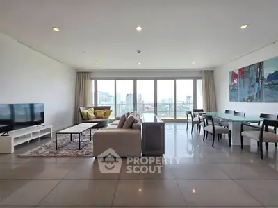 Spacious modern living room with city view and elegant dining area