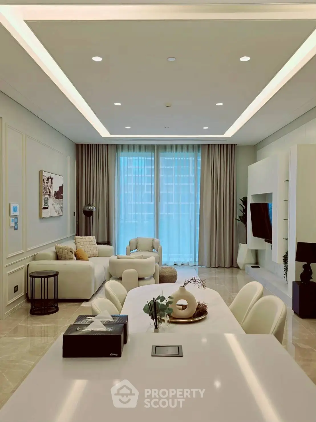 Luxurious modern living room with elegant decor and spacious seating area.