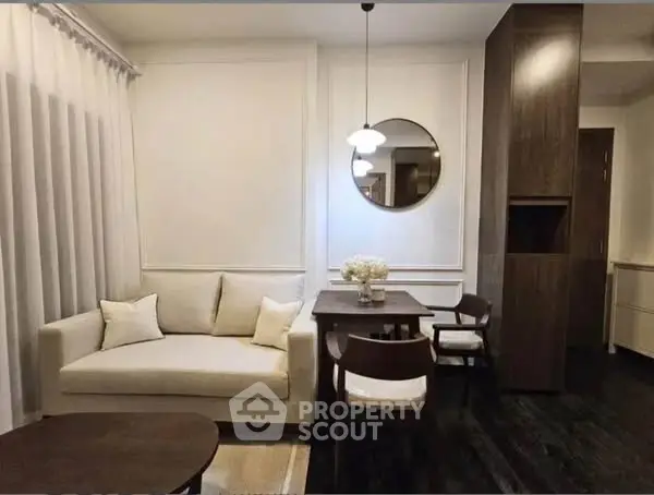 Chic modern living room with elegant decor and cozy seating area.