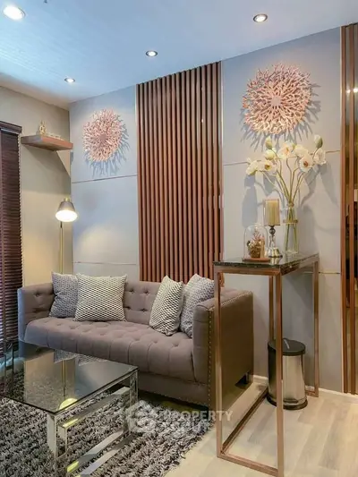 Elegant living room with modern decor, plush sofa, and stylish wall art, perfect for contemporary urban living.