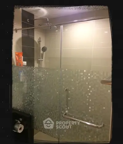 Modern bathroom with glass shower enclosure and sleek design