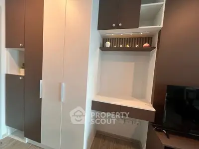 Modern living room with built-in storage and sleek TV setup