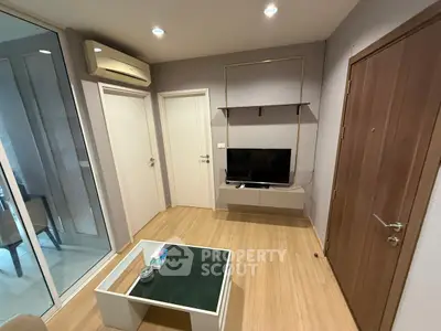 Modern living room with sleek TV setup and stylish coffee table