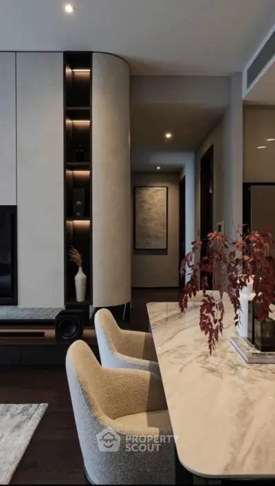 Modern living room with elegant marble table and plush chairs