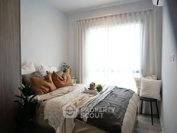 Cozy and stylish bedroom with natural light and modern decor