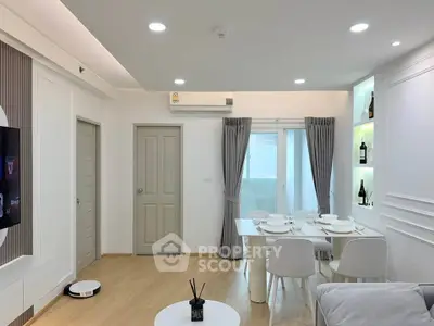 Modern living room with dining area, featuring sleek furniture and ambient lighting.
