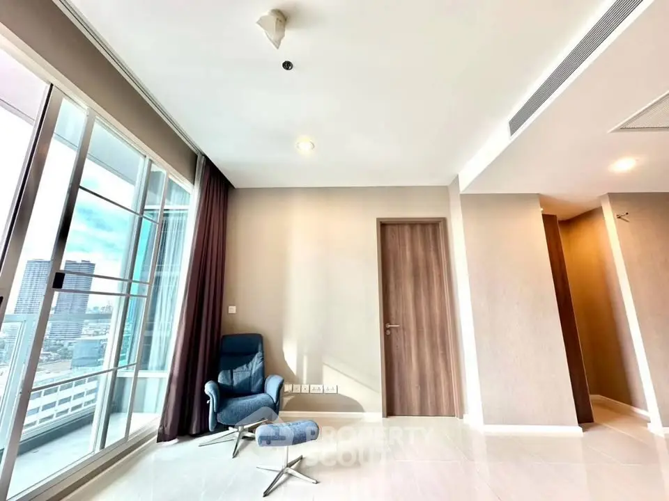 Spacious modern living room with city view and elegant chair