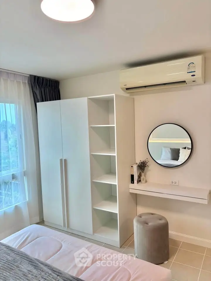 Modern bedroom with air conditioning and stylish decor