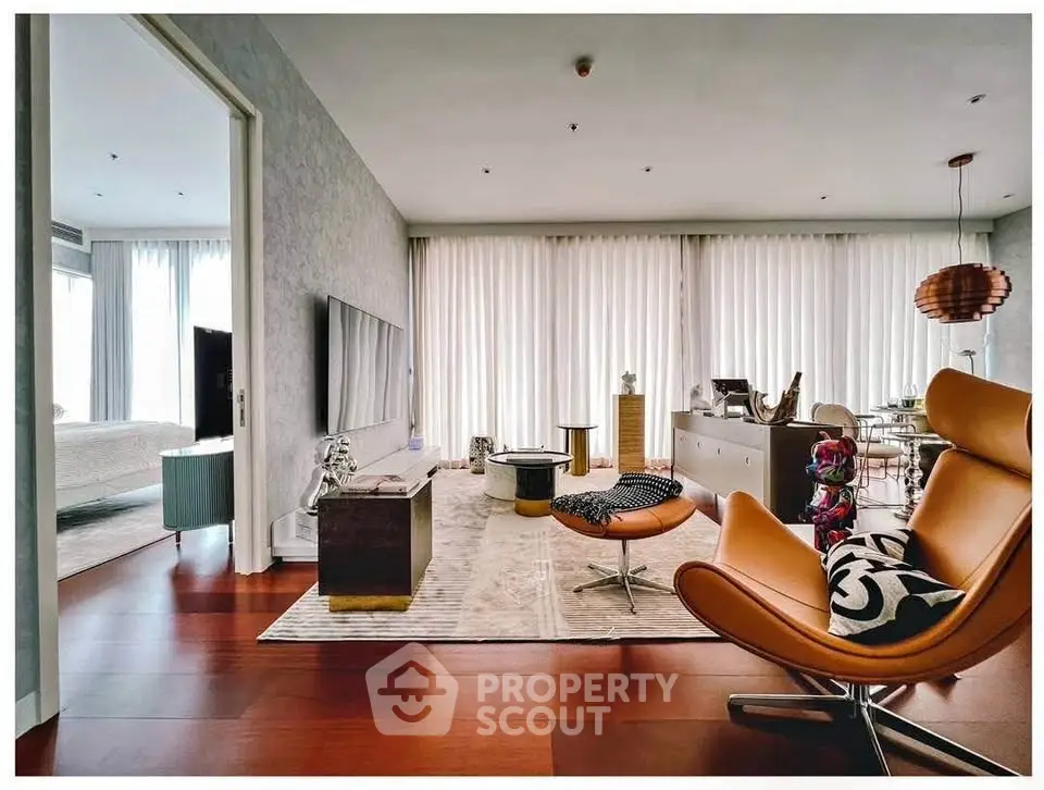 Luxurious modern living room with stylish furniture and open layout, featuring elegant decor and ample natural light.