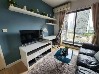 Modern living room with city view, featuring sleek furniture and stylish decor in a high-rise apartment.