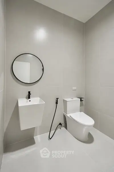 Modern minimalist bathroom with sleek fixtures and neutral tones