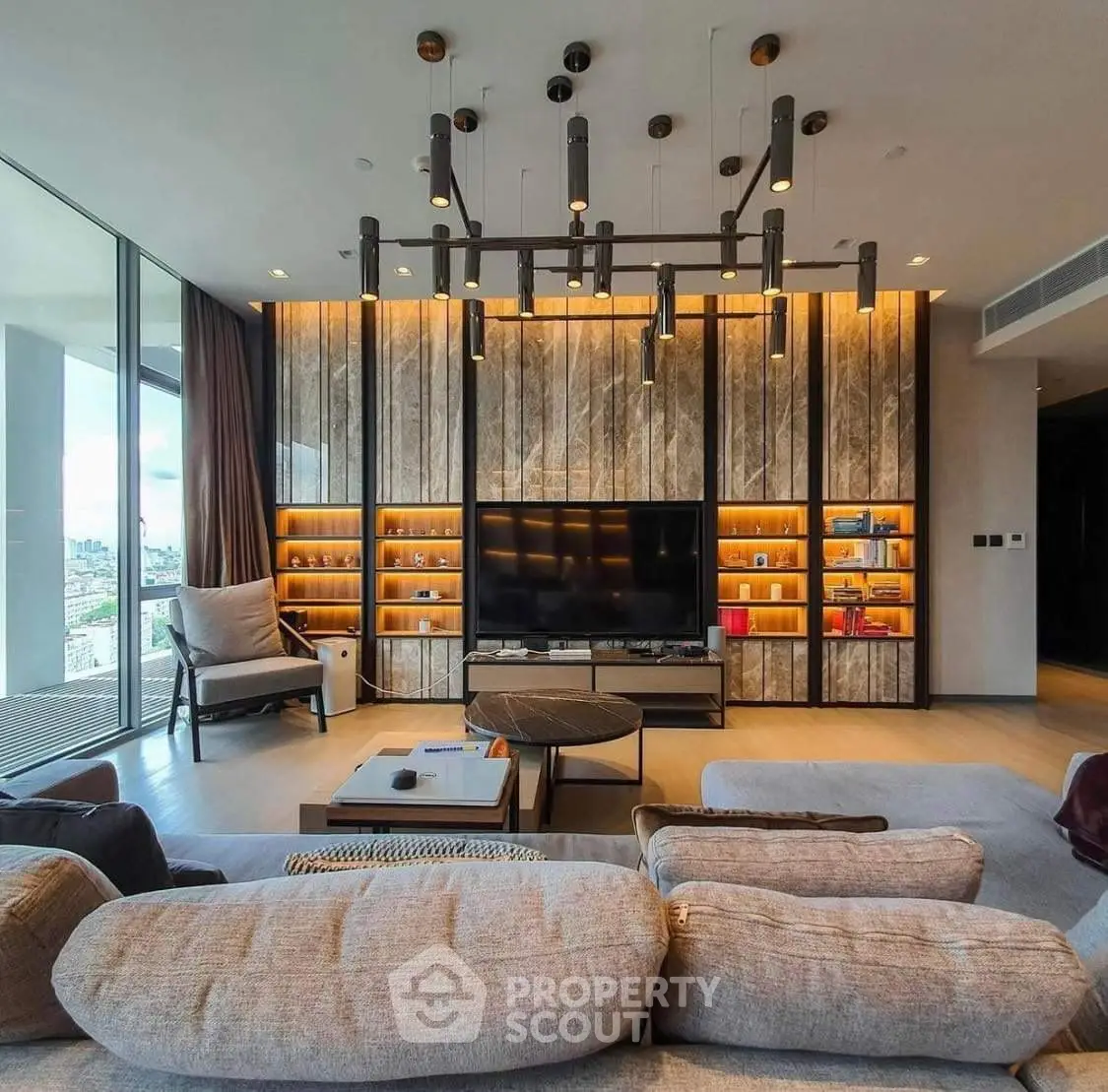 Luxurious modern living room with floor-to-ceiling windows and stylish lighting