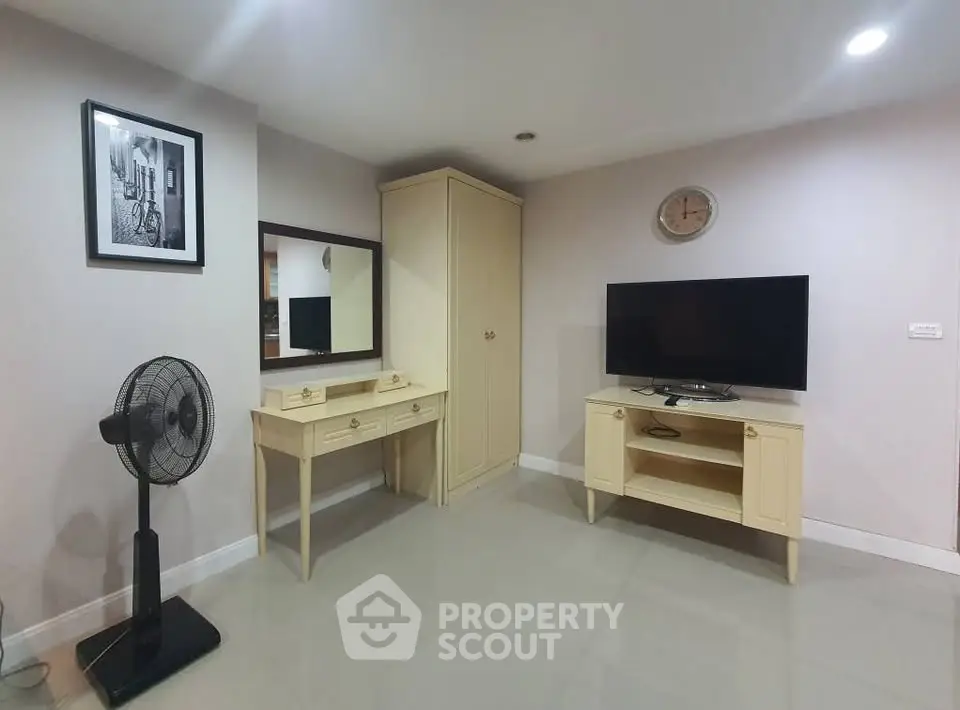 Cozy living room with modern TV setup and elegant furniture