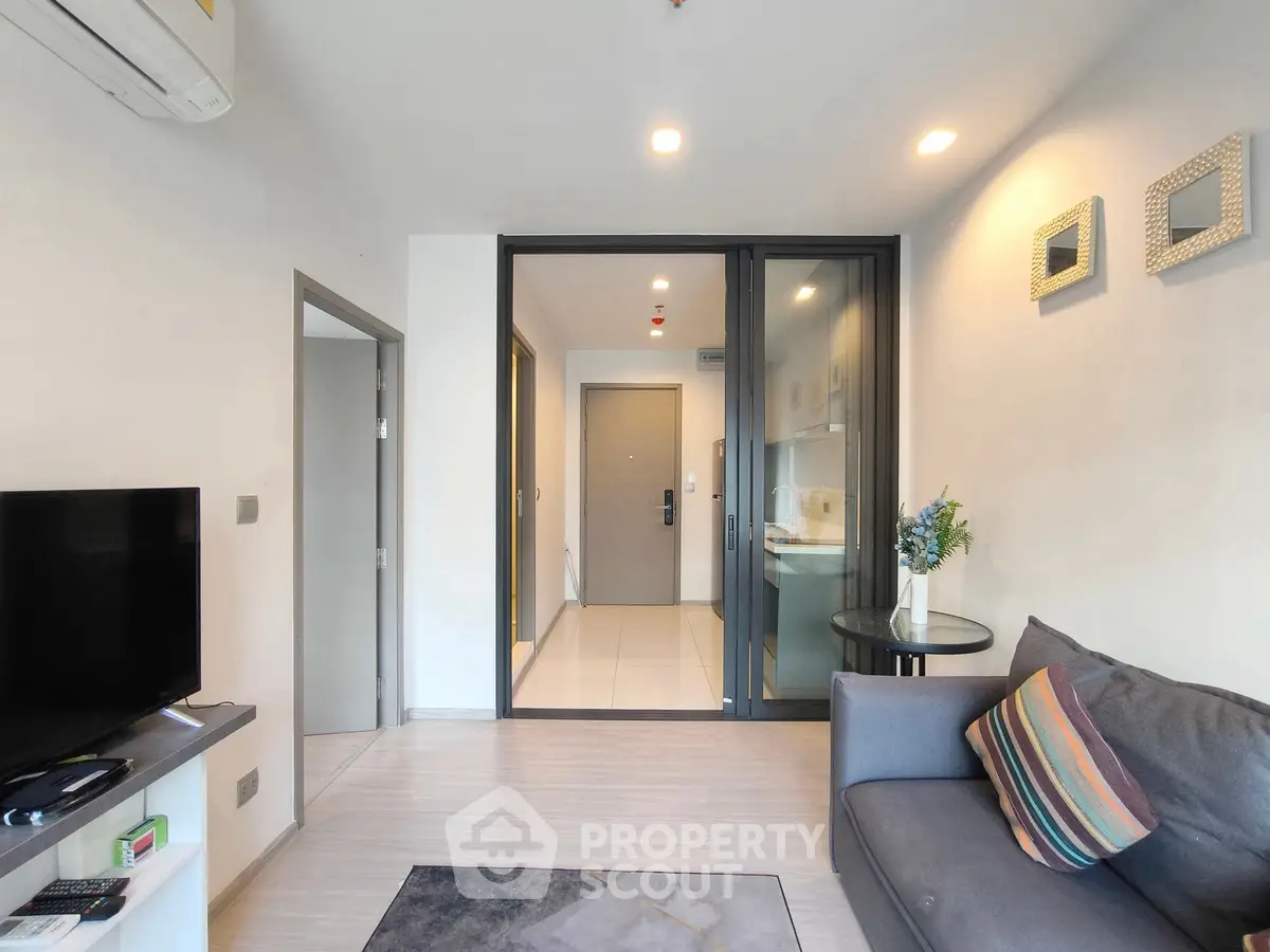 Modern living room with sleek design and cozy sofa in a stylish apartment.