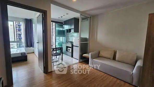 Modern apartment interior with open kitchen and cozy living area