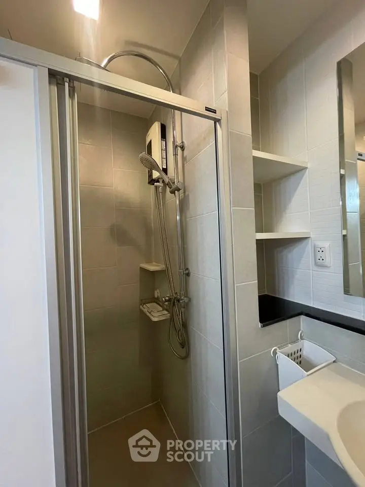 Modern bathroom with sleek shower enclosure and contemporary fixtures