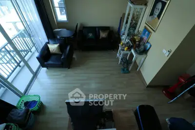 Spacious living room with balcony access and modern decor