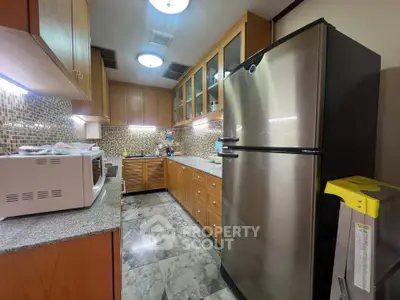 Spacious kitchen with modern appliances and stylish cabinetry