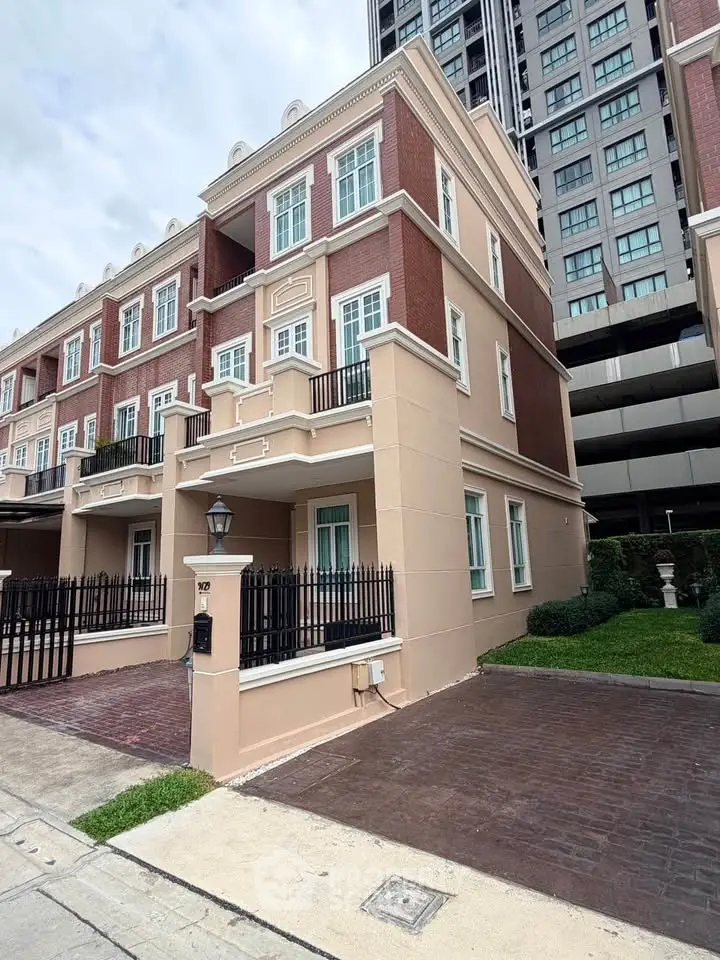 Elegant townhouse with classic architecture and modern design in urban setting.